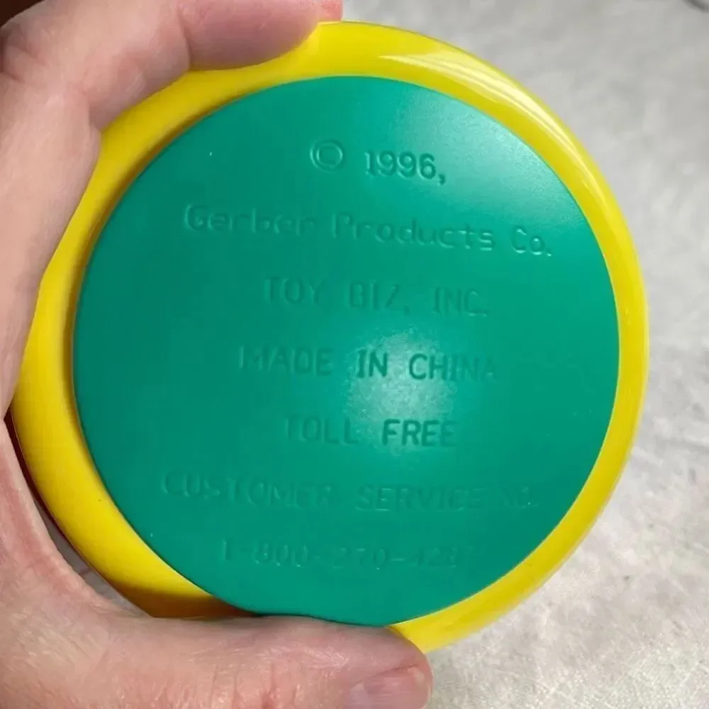 1996, Ring ‘n Roll Gerber Products Co. Toy Biz, Inc roundish rolling rattle infa